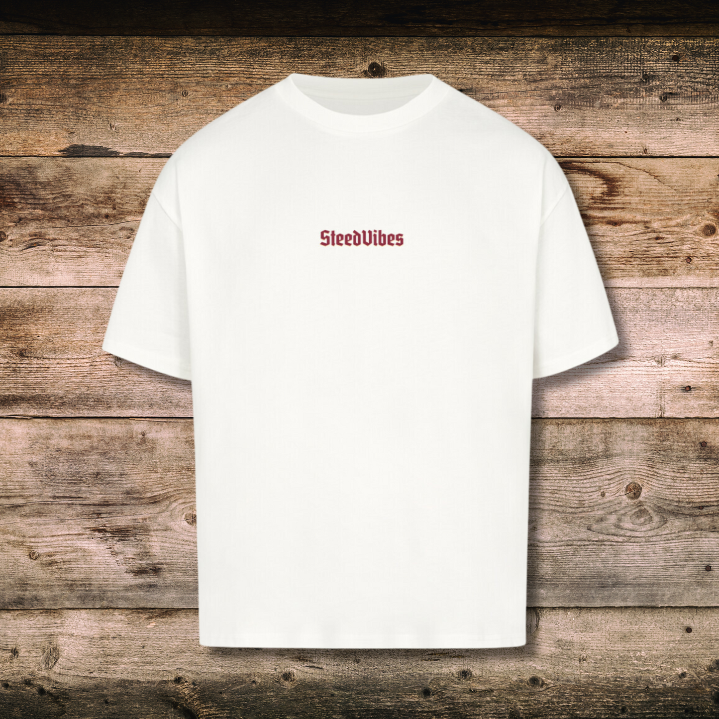 Oversized Herren-Shirt AUS FEUER GEBOREN in Weiss vorne auf Holz