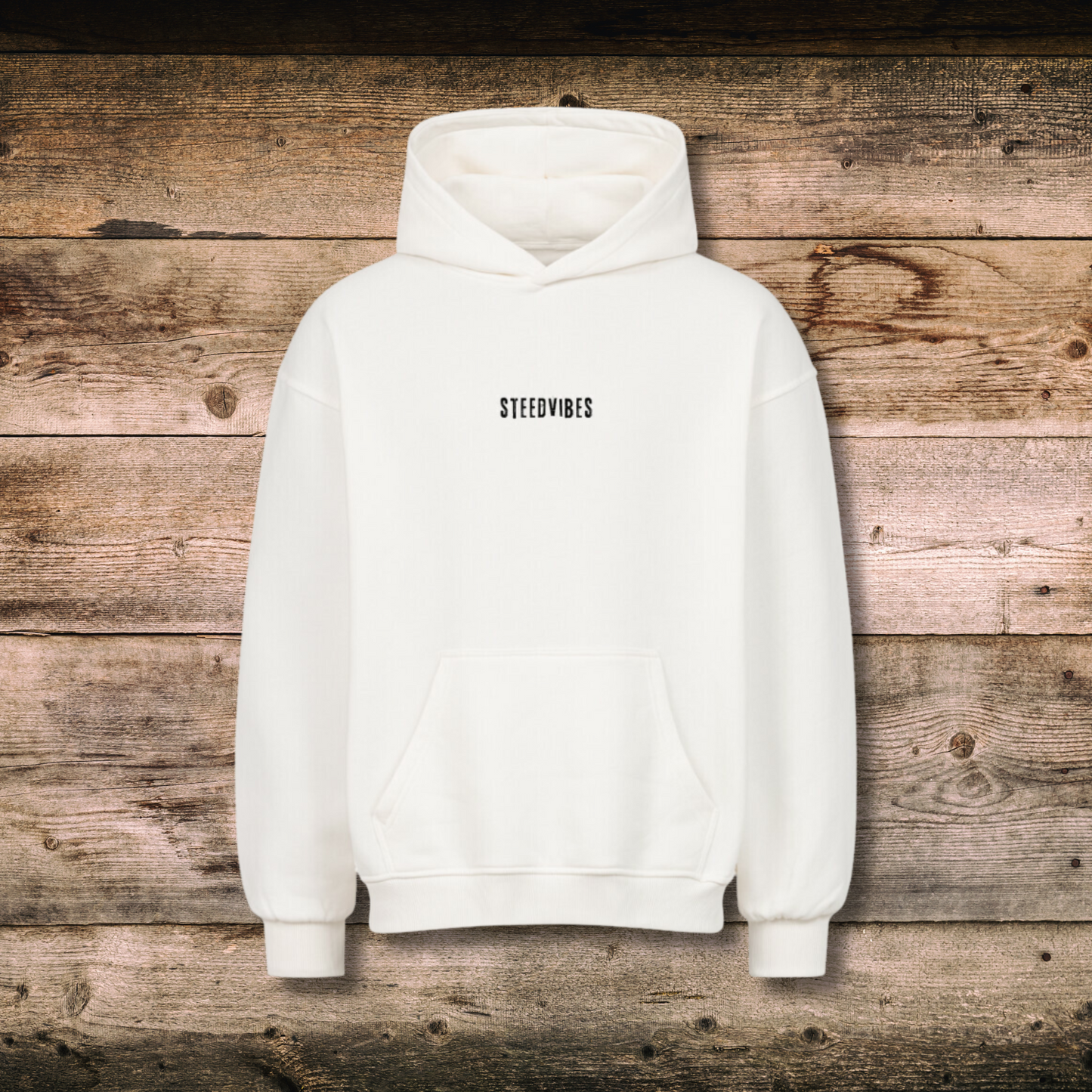 Oversized Damen-Hoodie EASILY DISTRACTED Weiss vorne auf Holz
