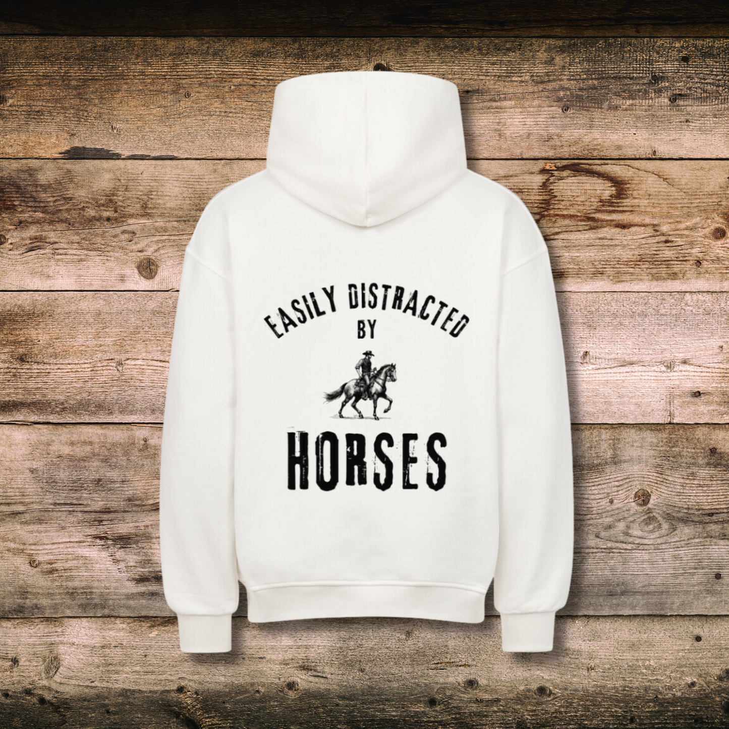 Oversized Damen-Hoodie EASILY DISTRACTED Weiss hinten auf Holz