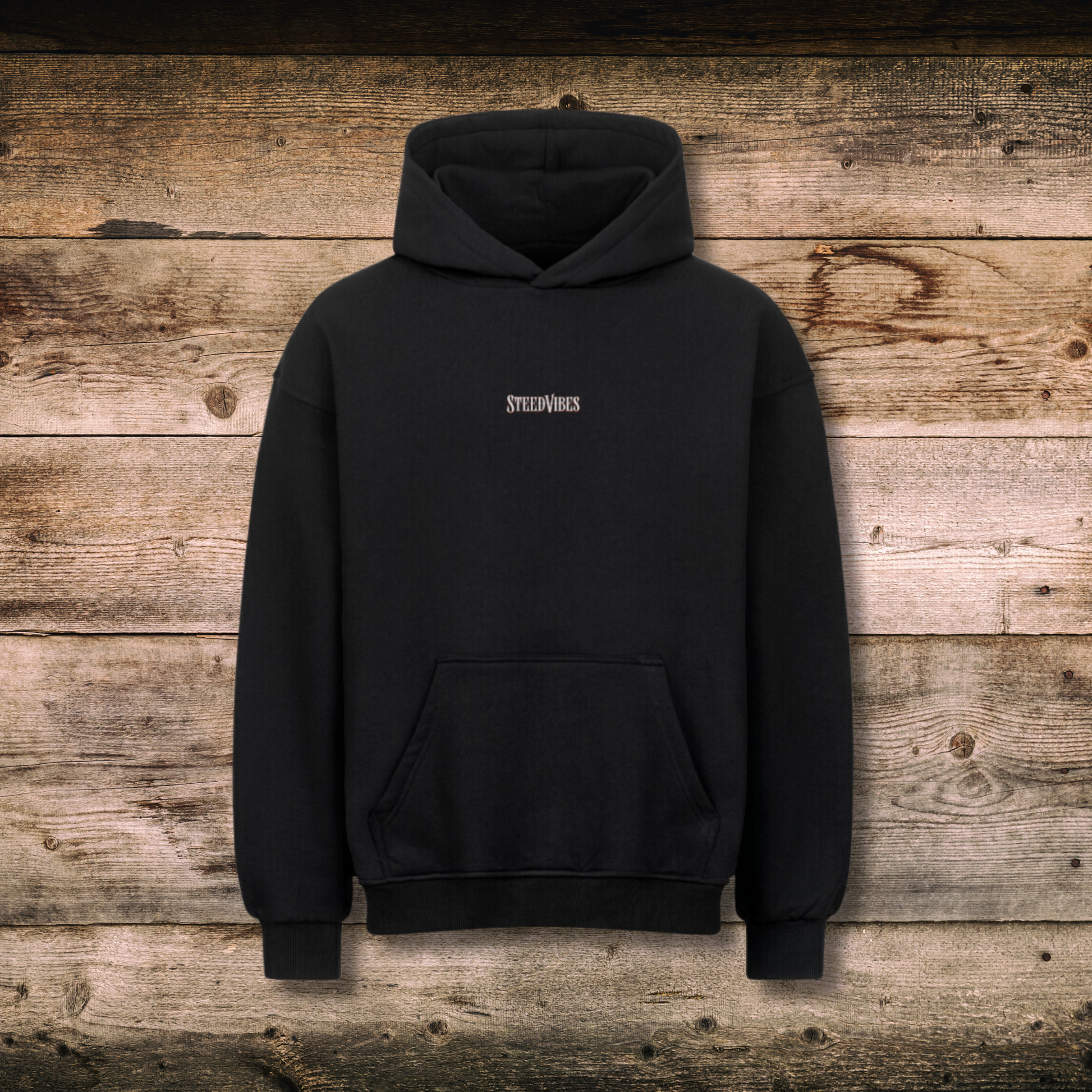 Oversized Hoodie HELL'S FARRIER in Schwarz vorne auf Holz