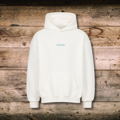 Oversized Damen-Hoodie YEE HAW in Weiss vorne auf Holz